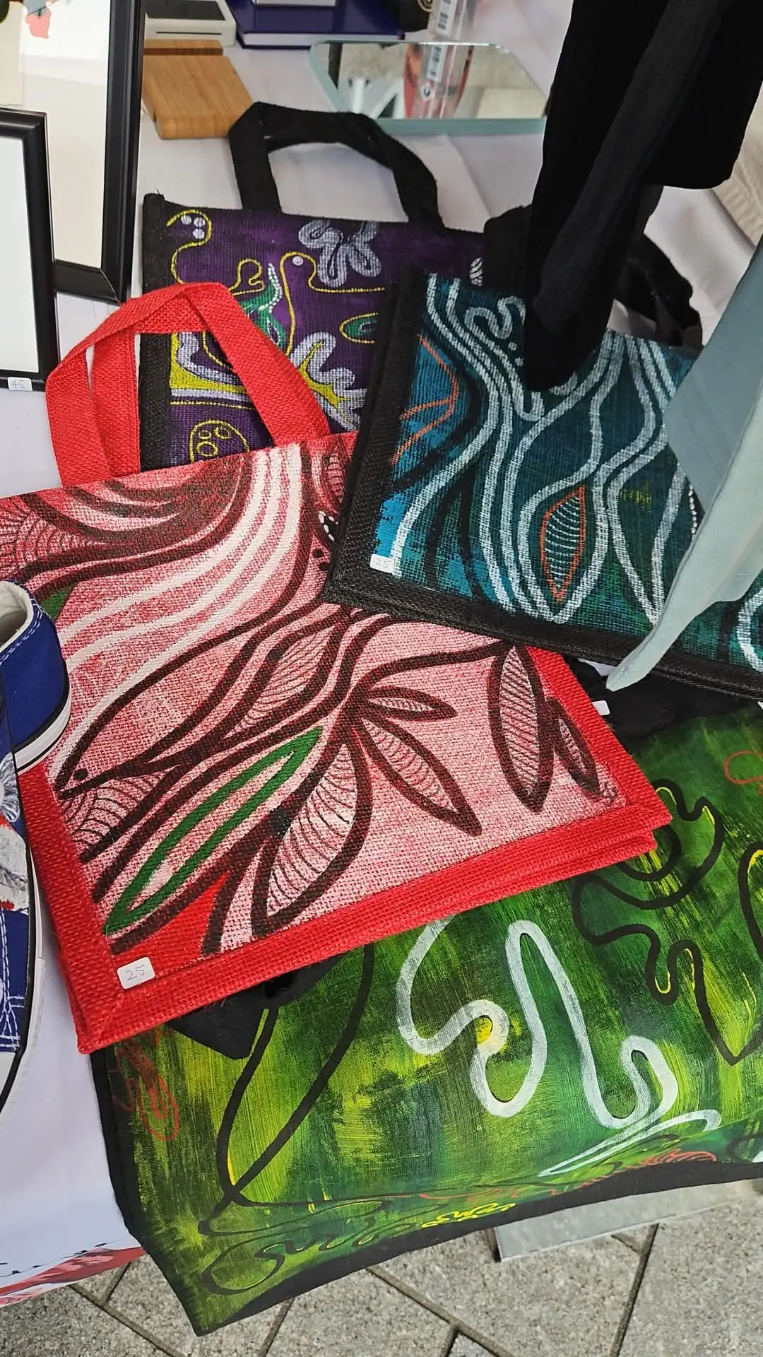 Customizable happy face tote bag for sale at a souvenir shop on Rokin, Amsterdam